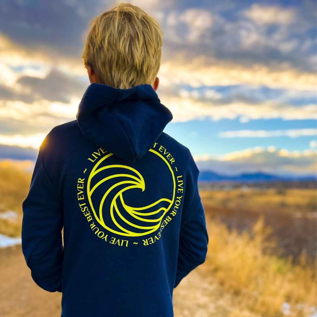 boy wearing ocean calling hoodie